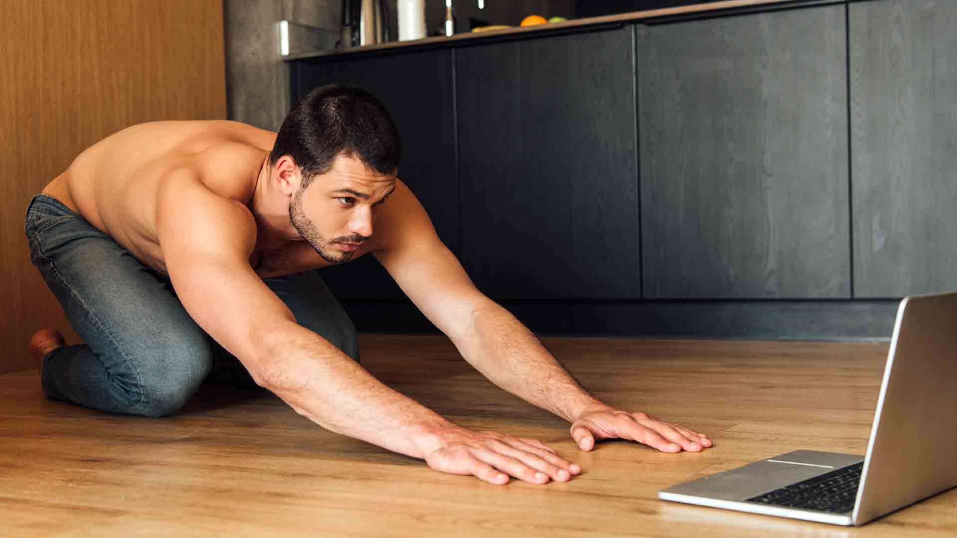 Man doing an online yoga class