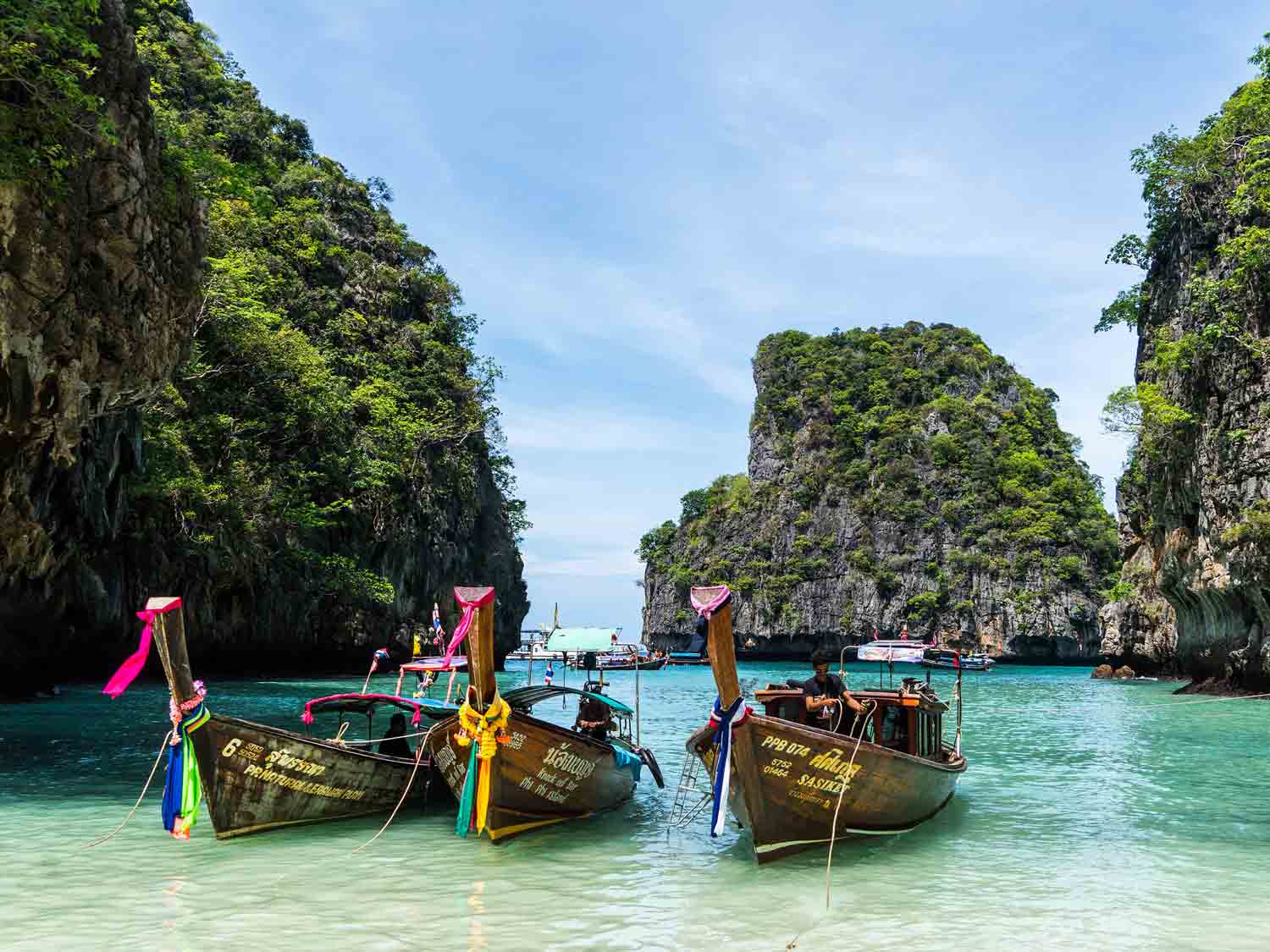 colourful long tail boats in thailand