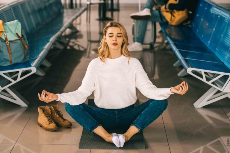 Girl meditating at the airport