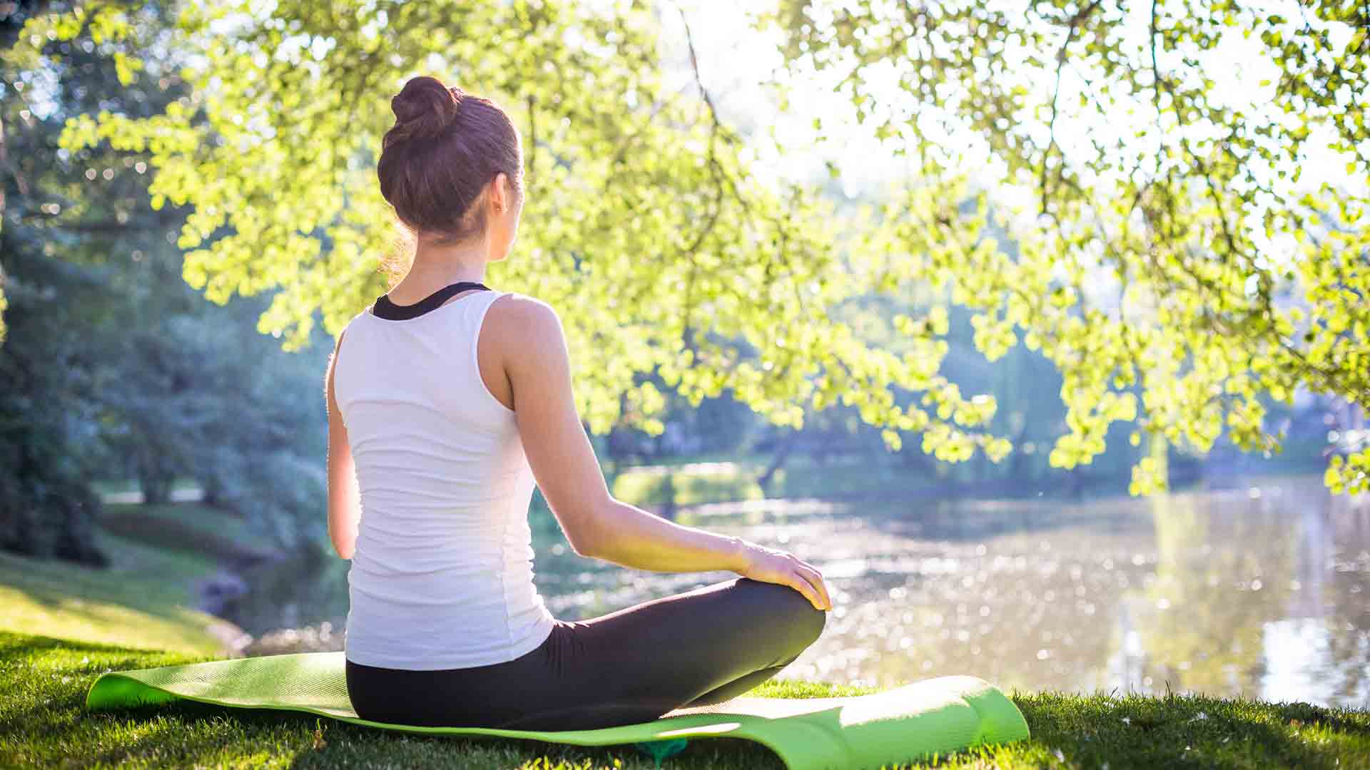 Meditating by a lake at a solo retreat