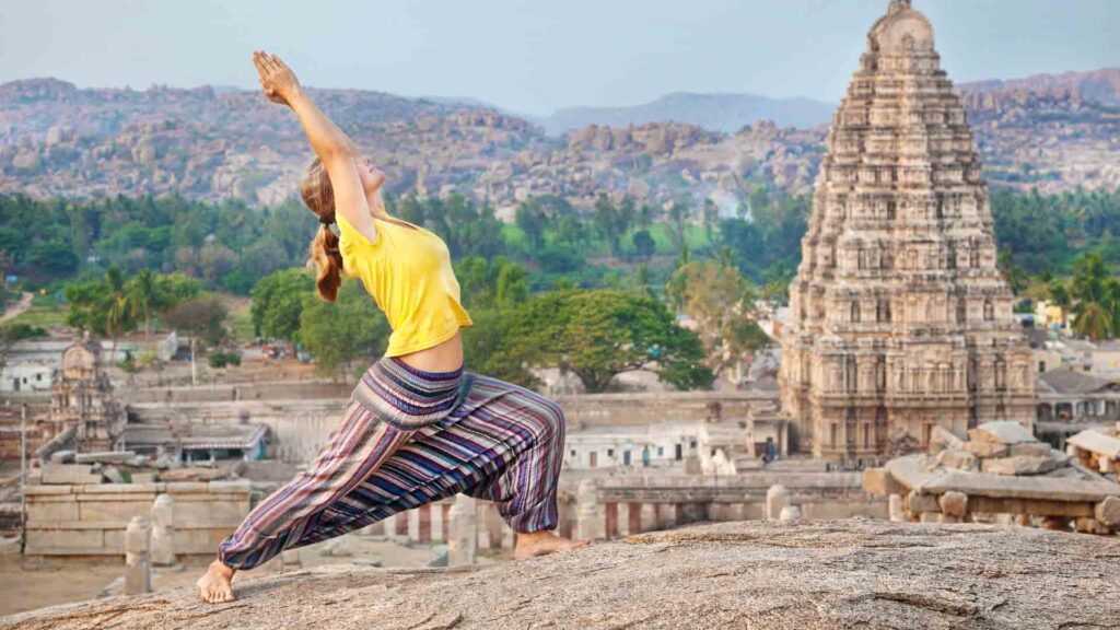 Yoga near temple in Hampi, India