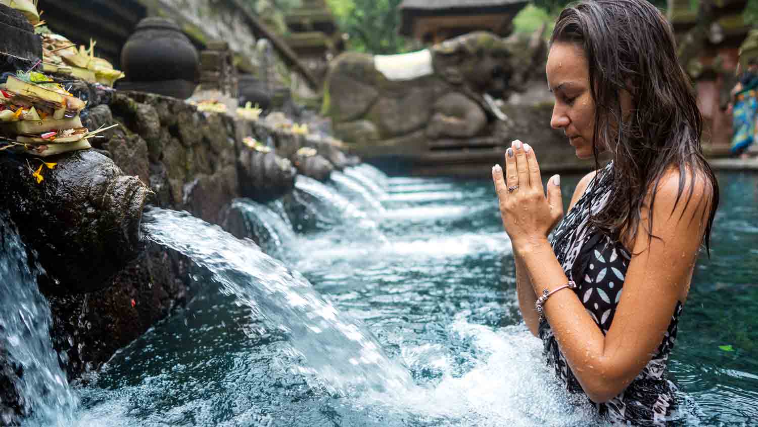 Praying at a Balinese water temple