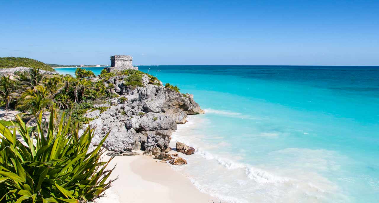 ruins on the beach in Tulum - one of the best areas for yoga teacher training in Mexico